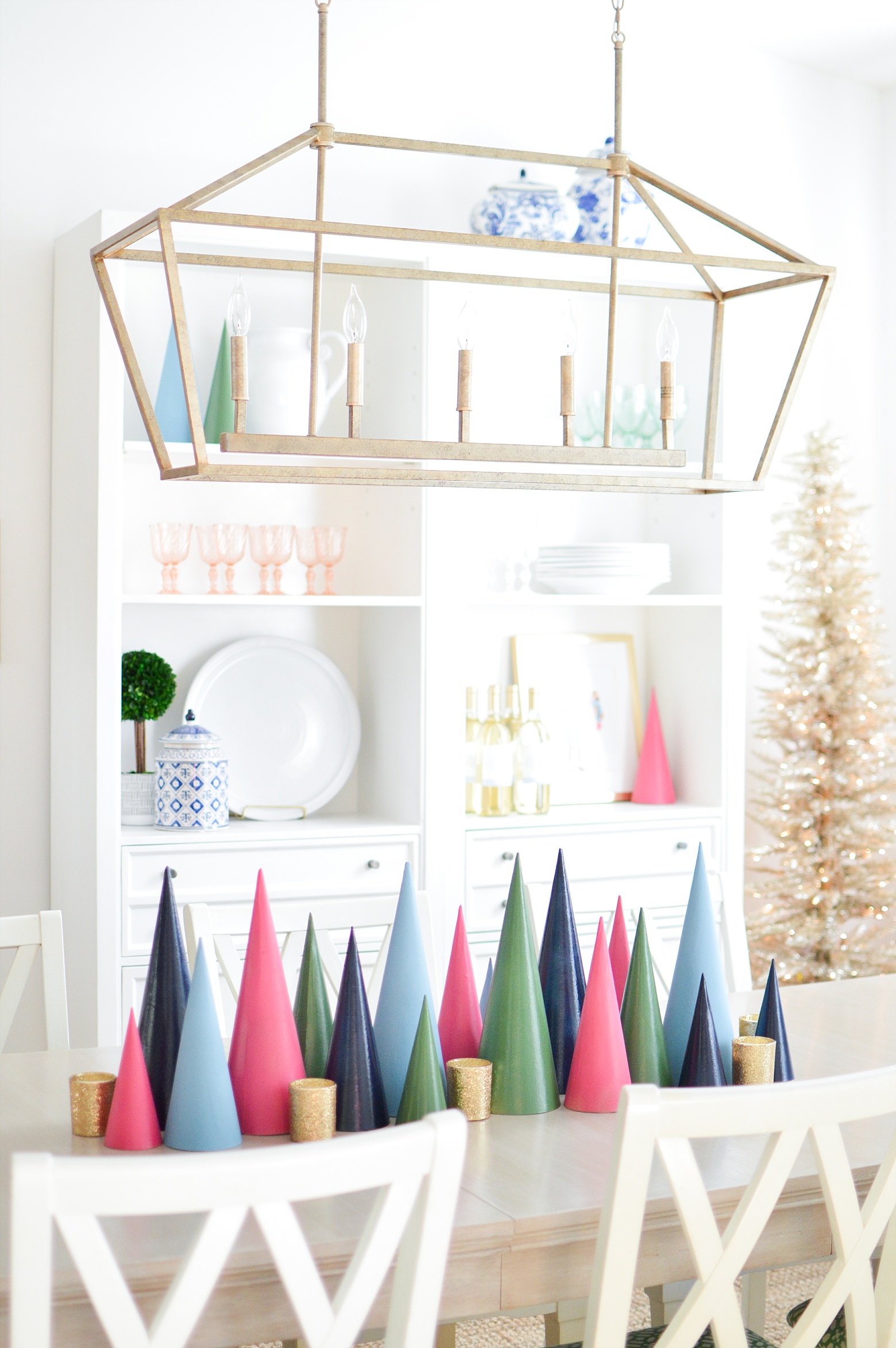 A Bright Colorful Modern Christmas Dining Room by Megan Martin Creative, painted Christmas Trees, holiday table, centerpiece, shelfie, gold Christmas tree