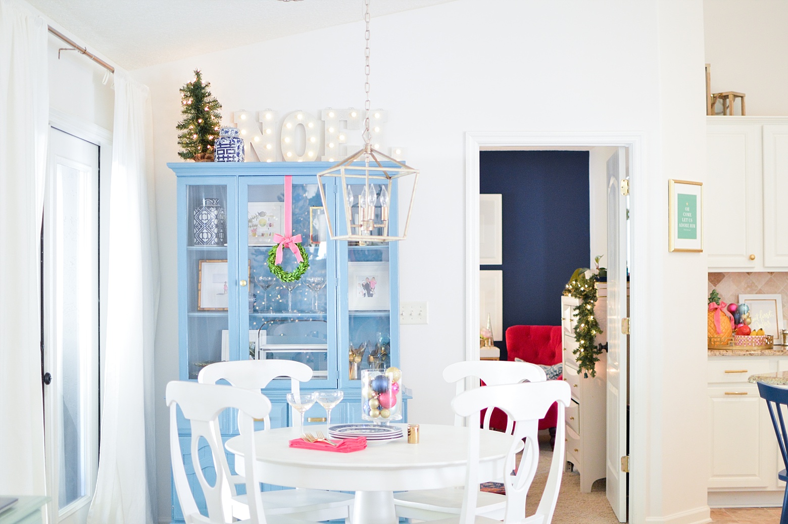 Bright Modern Colorful Christmas Kitchen Decor by Megan Martin Creative, blue hutch, noel marquee, white kitchen, chinoiserie, boxwood wreath, preppy Christmas