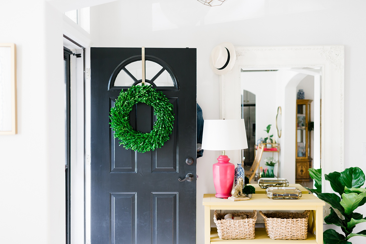 colorful entryway, black front door, boxwood wreath, all white walls, yellow table, fiddle leaf fig, colorful home on Megan Martin Creative