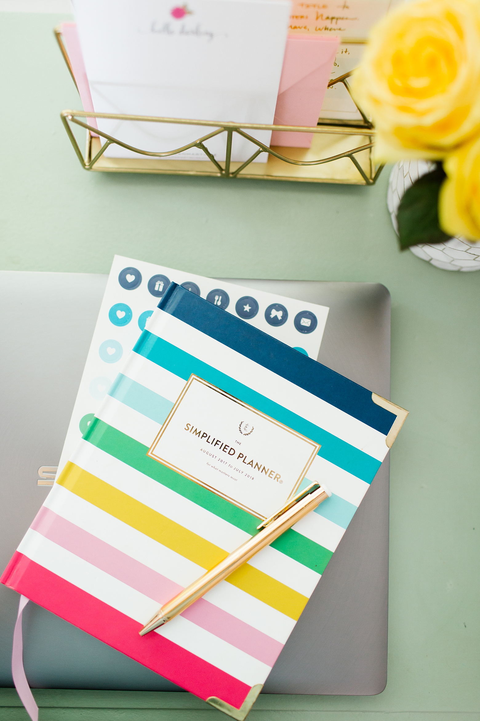 happy stripe simplified planner by emily ley, green chalk painted desk, bright and colorful living room design by Megan Martin Creative