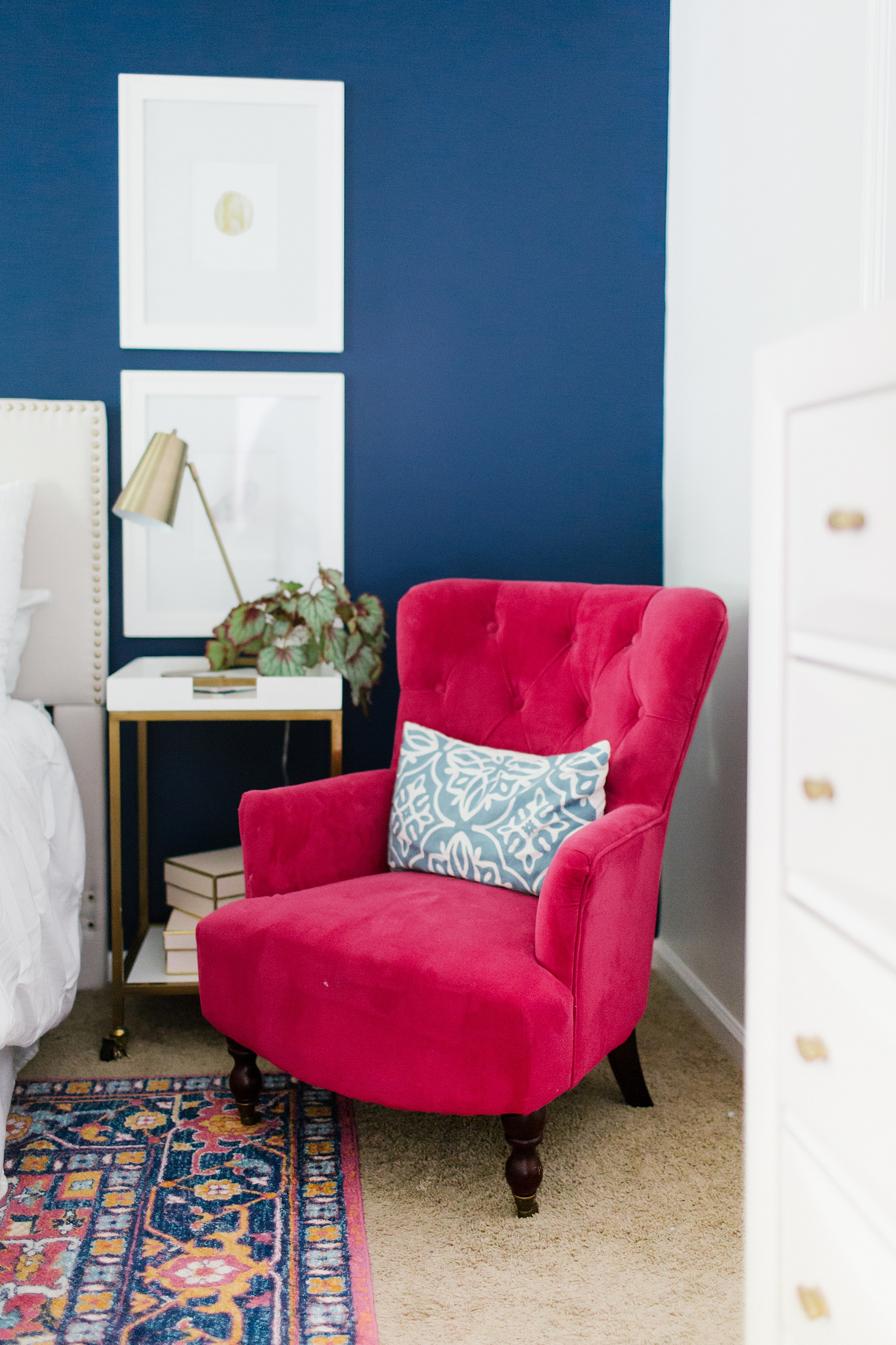 World Market Fuchsia Chair, navy walls, colorful home, Navy and pink master bedroom, bar cart night stand, gold task lamp, design by Megan Martin Creative 