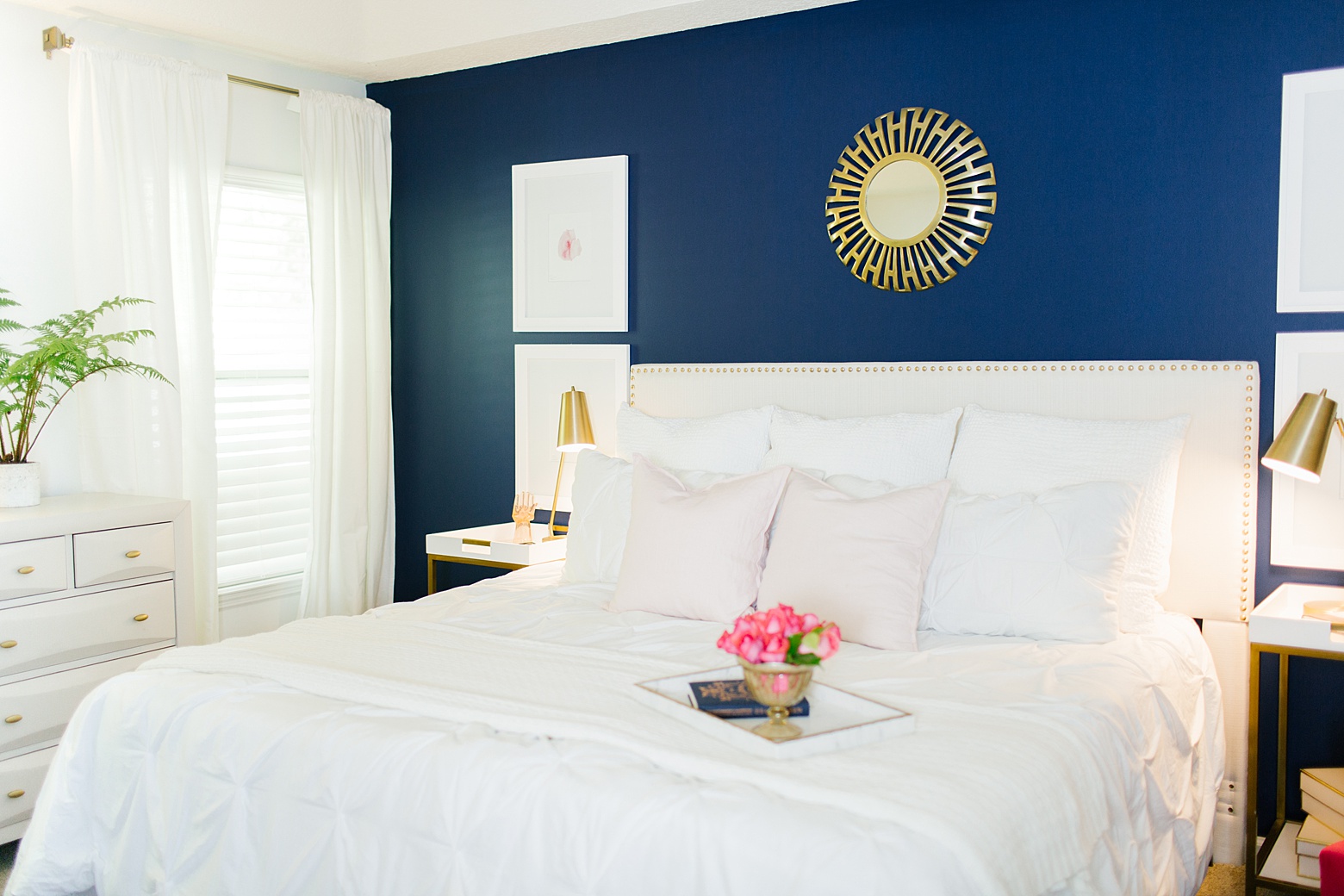 Modern Navy and Pink Master Bedroom on Megan Martin Creative, White comforter, upholstered headboard, gold task lamp, navy accent wall, white walls